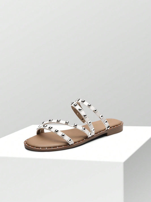 These slide <a href="https://canaryhouze.com/collections/women-canvas-shoes?sort_by=created-descending" target="_blank" rel="noopener">sandals</a> are a must-have for summer! The clear design is both stylish and versatile, making them perfect for any outfit. The studded rhinestones add a touch of elegance, while the comfortable fit ensures all-day wearability. Stay trendy and comfortable this summer with our cute and stylish slide sandals.
