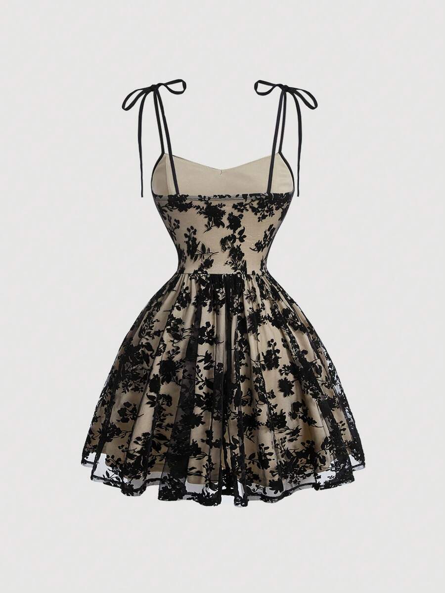 Crafted from luxurious black velvet with delicate mesh detailing, this spaghetti strap dress seamlessly transitions from evening celebrations to getaway moments. The refined silhouette flatters the figure while the soft velvet fabric drapes elegantly against the skin. Mesh accents add contemporary sophistication without compromising comfort. Perfect for cocktail parties, formal dinners, or resort wear, this versatile piece delivers polished style for any occasion that calls for understated glamour.