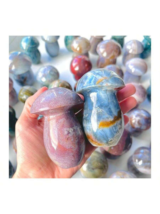 Elevate your home decor with our Crystal Magic Wand made from Ocean Jasper and Mushroom Quartz. This natural crystal wand exudes positive energy and promotes harmony and balance. Perfect for those seeking a touch of magic in their space.