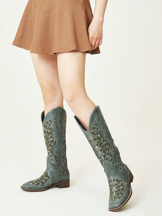 Step into style with our Rhinestone Cowgirl Chic Cowboy <a href="https://canaryhouze.com/collections/women-boots" target="_blank" rel="noopener">Boots</a>! These boots feature beautiful embroidery and sparkling rhinestones, giving them a unique, eye-catching look. The chunky mid heel provides both comfort and height, making them the perfect choice for any occasion. Elevate your wardrobe with these chic and timeless boots.