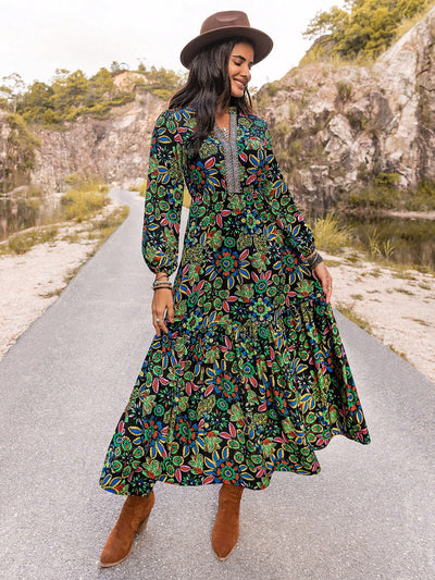 Effortlessly turn heads in our Enchanted Bloom Dress, featuring a stunning V-neck and eye-catching lantern sleeves. The vibrant print adds a touch of charm, while the flowy silhouette flatters all body types. Elevate your style with our must-have stunner.