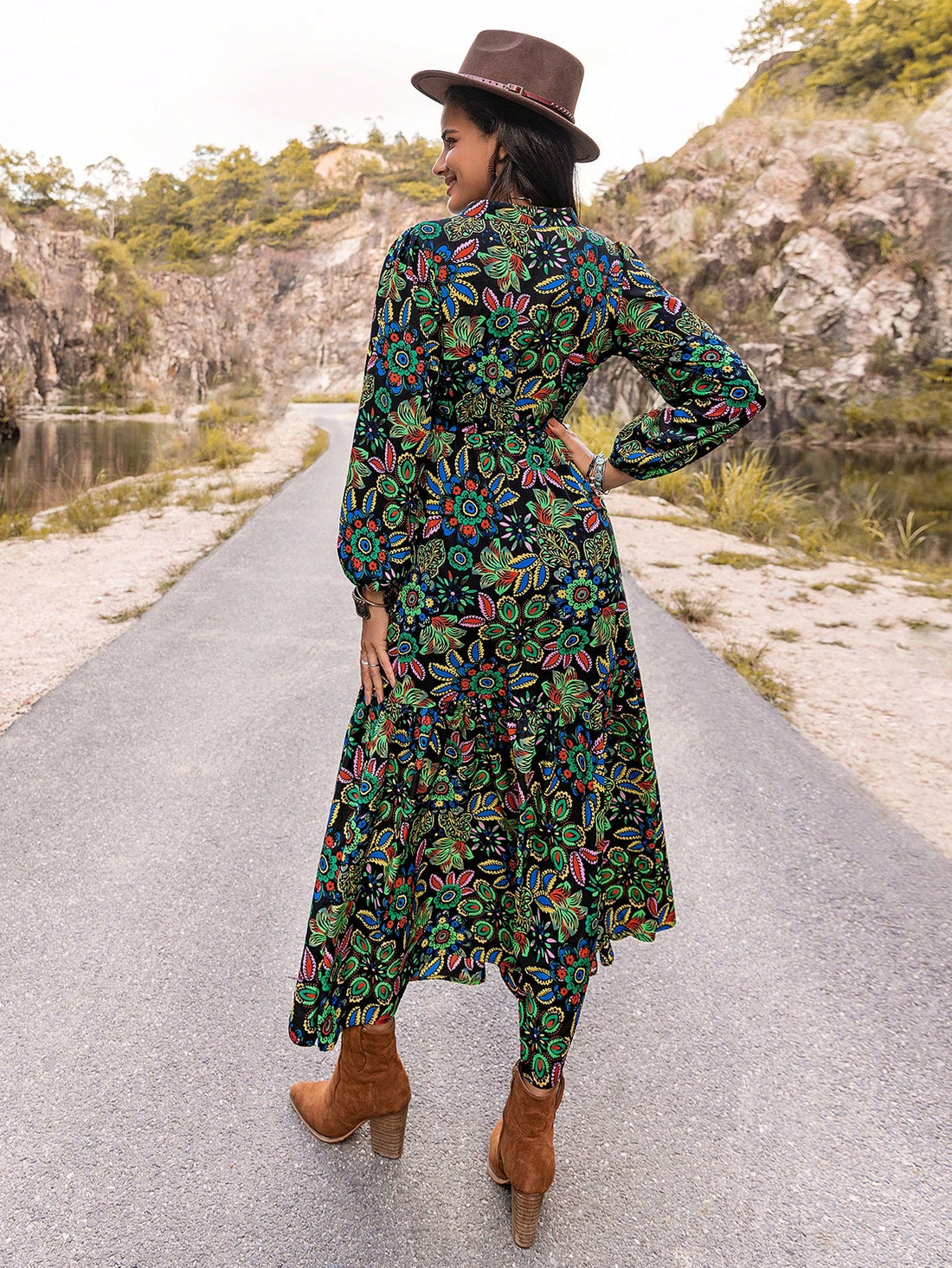 Effortlessly turn heads in our Enchanted Bloom Dress, featuring a stunning V-neck and eye-catching lantern sleeves. The vibrant print adds a touch of charm, while the flowy silhouette flatters all body types. Elevate your style with our must-have stunner.
