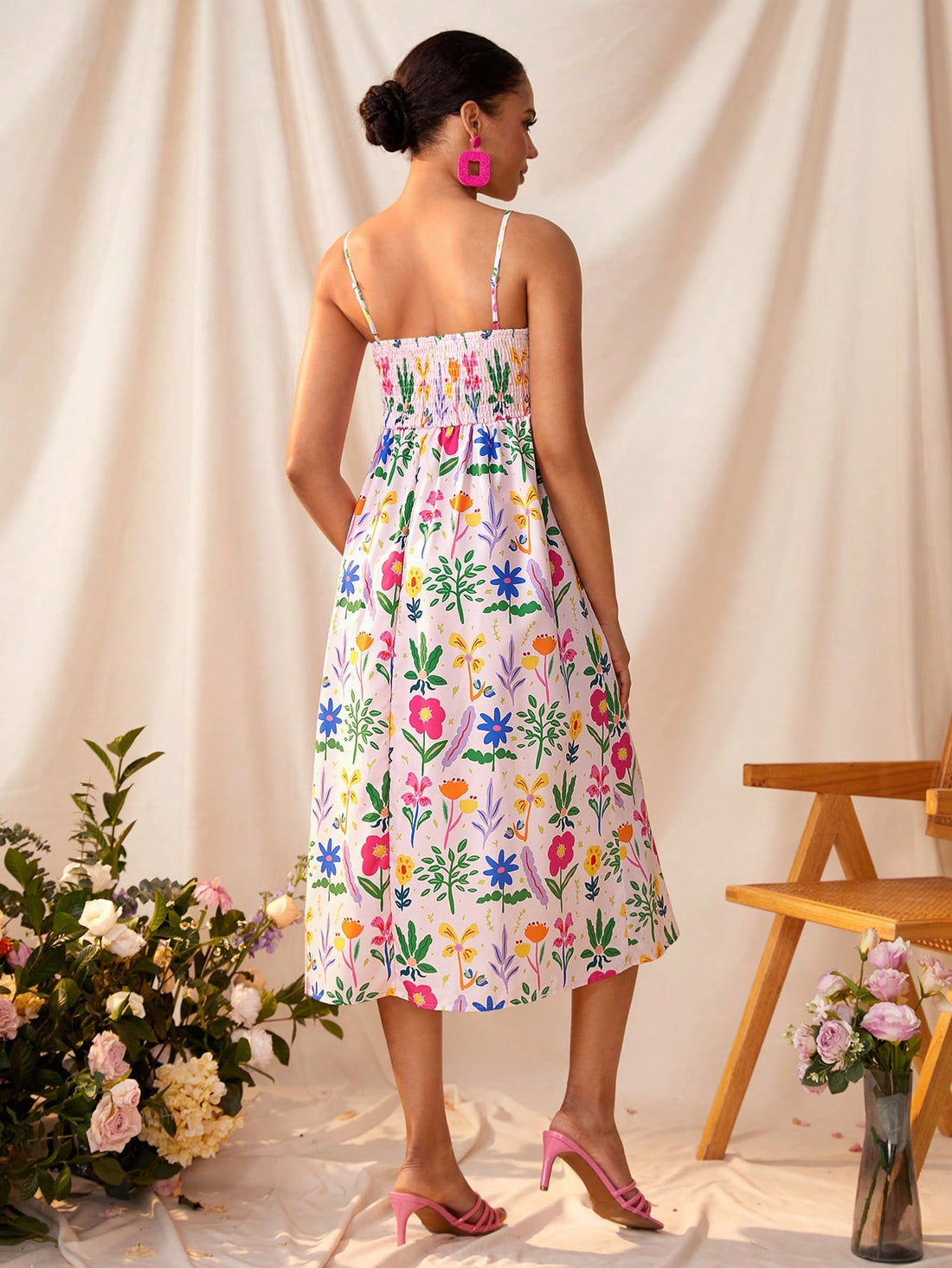 Be a free-spirited fashionista in this Elegant Bohemian Floral Cami Dress, perfect for Summer festivals and parties. Let the vibrant floral print and flowy fit take you on a whimsical journey. Dance the night away in comfort and style.