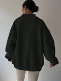 Back worn view of black oversized sweatshirt with wide rib-knit hem and cuffs