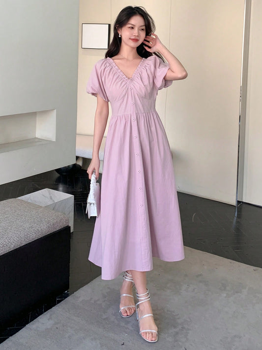 Elevate your wardrobe with our Flirty and Fabulous: Women's Frill-Edged V-Neck Dress. Designed with a flattering V-neckline and delicate frill edges, this dress exudes femininity and style. Crafted with high-quality materials, it offers both comfort and sophistication for any occasion. Perfect for the modern woman.