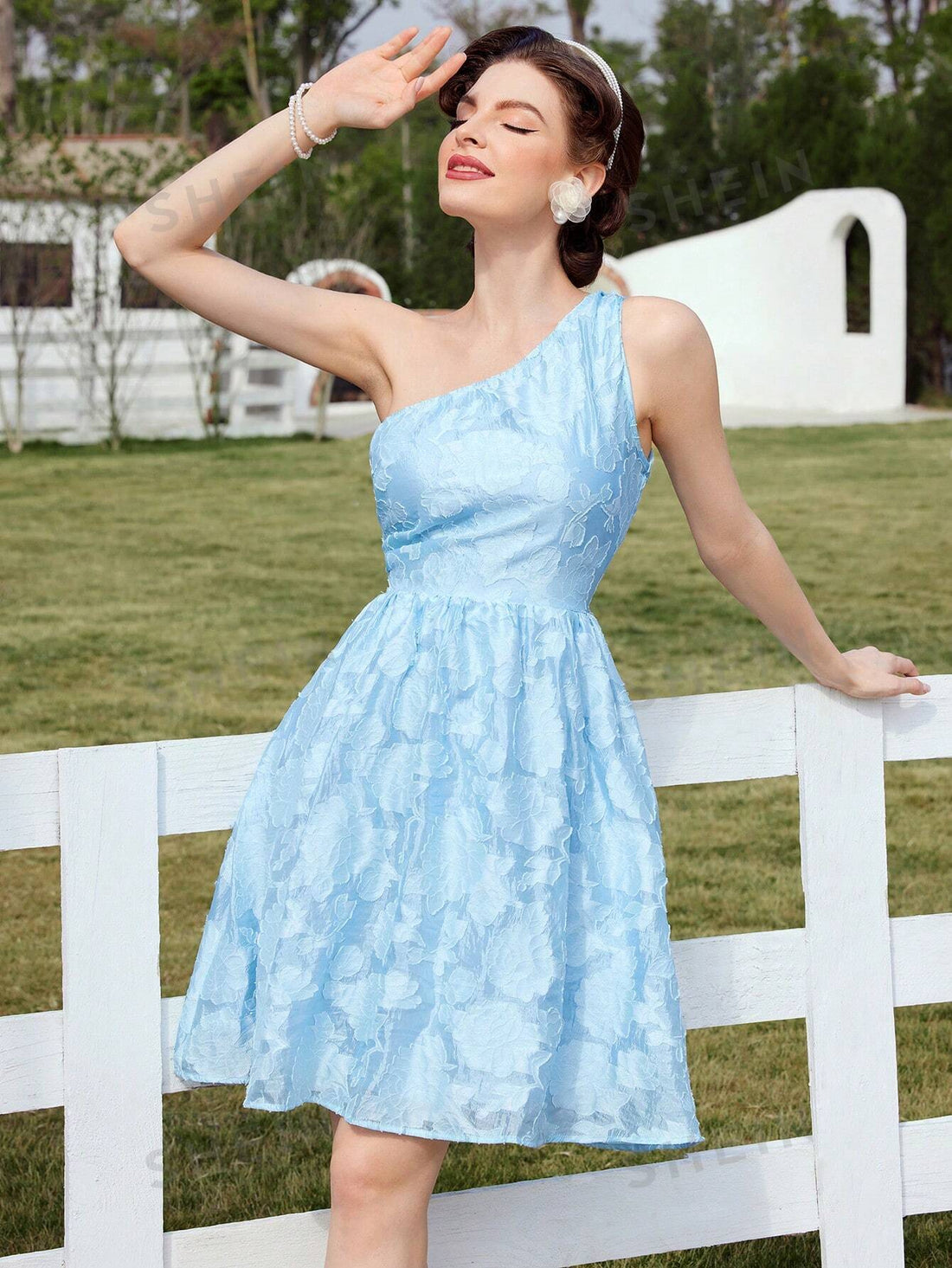 Introducing the Floral Fantasy: One-Shoulder Pleated Vacation Dress, perfect for your spring and summer getaways. This stunning dress showcases a delicate floral print and a stylish one-shoulder design, while its pleated construction adds a touch of elegance. Enjoy the ultimate combination of fashion and comfort while making a statement wherever you go.