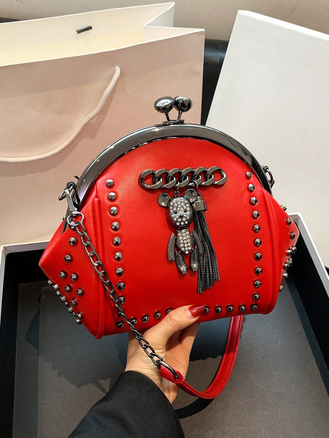 Add a touch of vintage style to your outfit with our Vintage Rivet Fringe Shoulder Bag. Made with stylish crossbody chain and adorned with rivet fringe, this bag is perfect for any fashion-forward individual. Keep your essentials close and add an edge to your look with this versatile handbag.