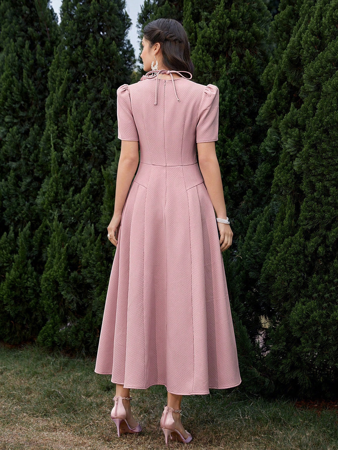 This stylish dress from Blooming Beauty features a unique 3D flower design and faux button accents. The solid color and short sleeve style make it perfect for any occasion. Add a touch of elegance to your wardrobe with this beautiful dress.