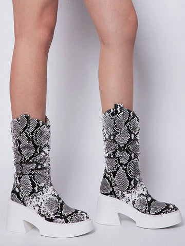 Elevate your fashion game with our Slither in Style: Snake Pattern Mid-Calf Cowboy Boots for Women. Designed with a snake pattern, these boots are perfect for adding a touch of edgy style to any outfit. Made with high-quality materials, these boots are comfortable and durable.