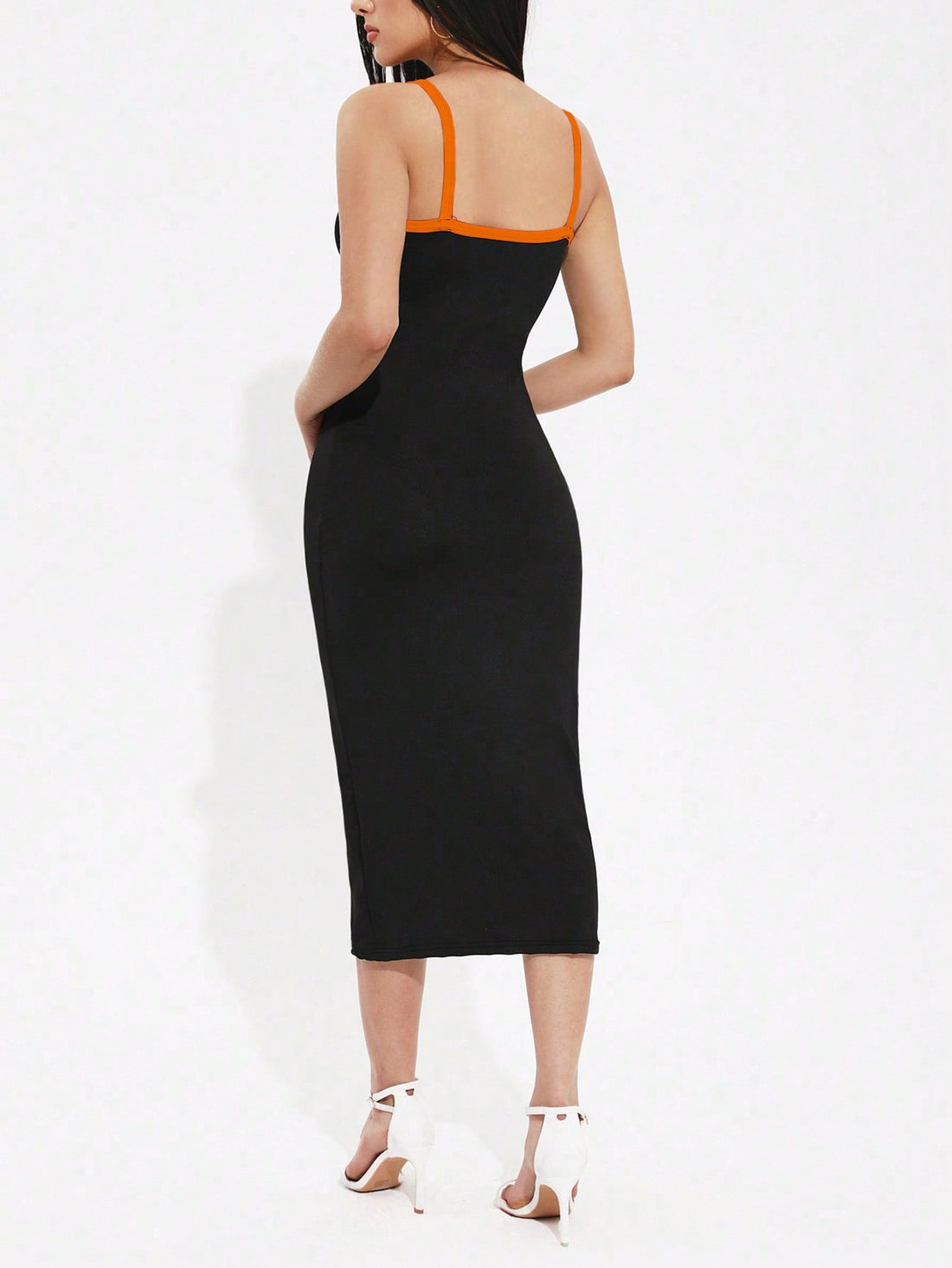 Make a statement in this stunning colorblock maxi dress that effortlessly blends sophistication with fun. The delicate spaghetti straps frame your shoulders beautifully, while the flowing silhouette skims your figure in all the right ways. A cheeky side slit adds just the right amount of sass and movement, perfect for twirling from brunch to evening events. The bold color blocking creates visual interest and flatters every skin tone. Dress it up with heels and jewelry or keep it casual with sneakers—this ve