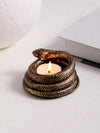 Expertly crafted from resin, this Mystical Resin Snake Candlestick is a unique desktop decoration that will add a touch of mystery and atmosphere to any space. Its intricate snake design showcases the skilled craftsmanship, making it a perfect statement piece for any room.
