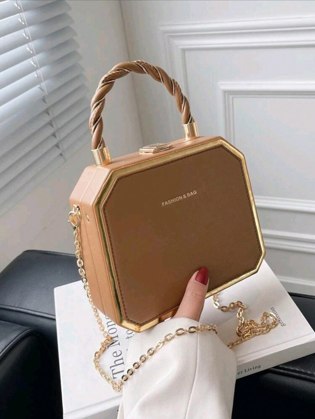 Introducing Versatile Chic: a fashion-forward boxed bag designed for the modern woman. This versatile clutch offers both style and functionality, making it a must-have accessory. With its sleek design and spacious interior, it's perfect for any occasion, from a night out to a business meeting. Elevate your look with Versatile Chic.