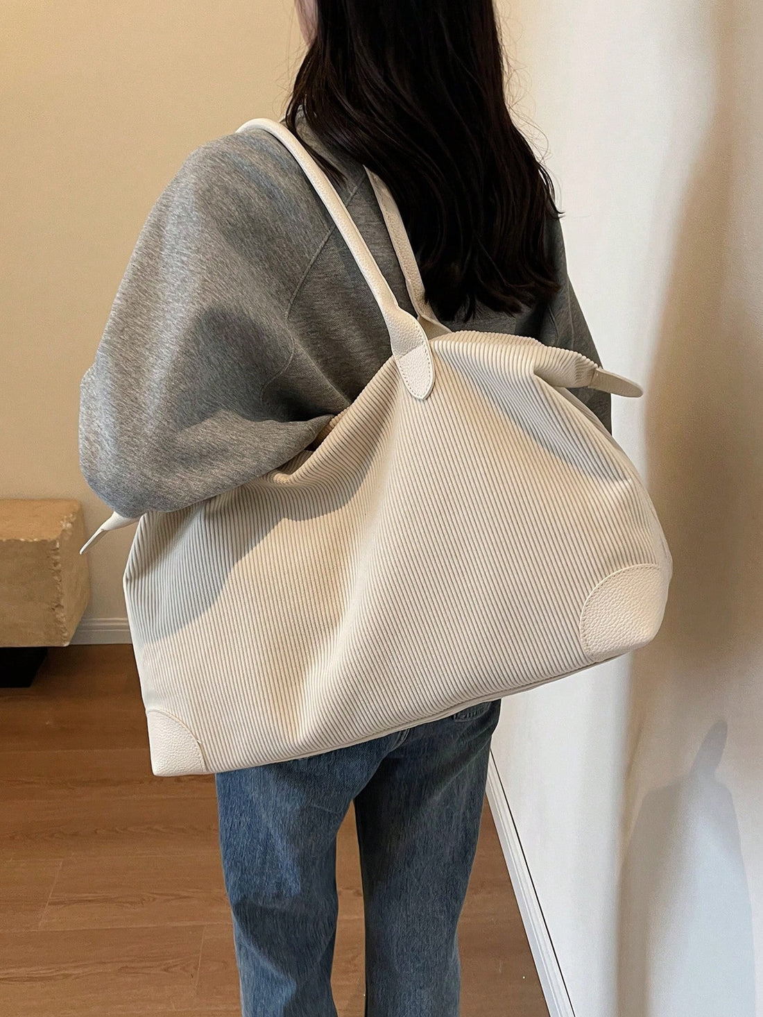 Experience chic and practical fashion with our Creamy Corduroy Chic tote bag! Made with a large capacity, it's perfect for carrying all your essentials. The creamy corduroy design adds a stylish touch, while the spacious interior and sturdy straps provide convenience and durability.