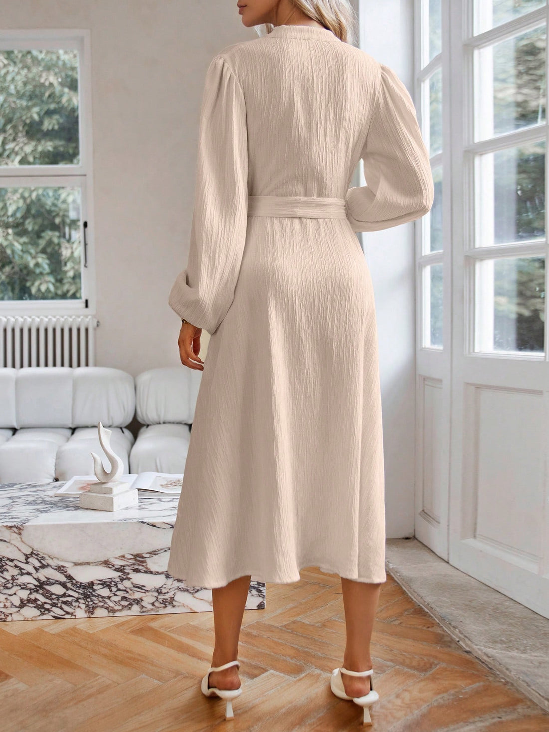 Ready to turn heads on your next vacation? Our Chic Textured Button-Front Lantern Sleeve Dress is the perfect choice! Featuring a stylish button-front design and trendy lantern sleeves, this dress will keep you looking chic and on-trend while you relax and explore. Don't miss out on this must-have vacation piece!