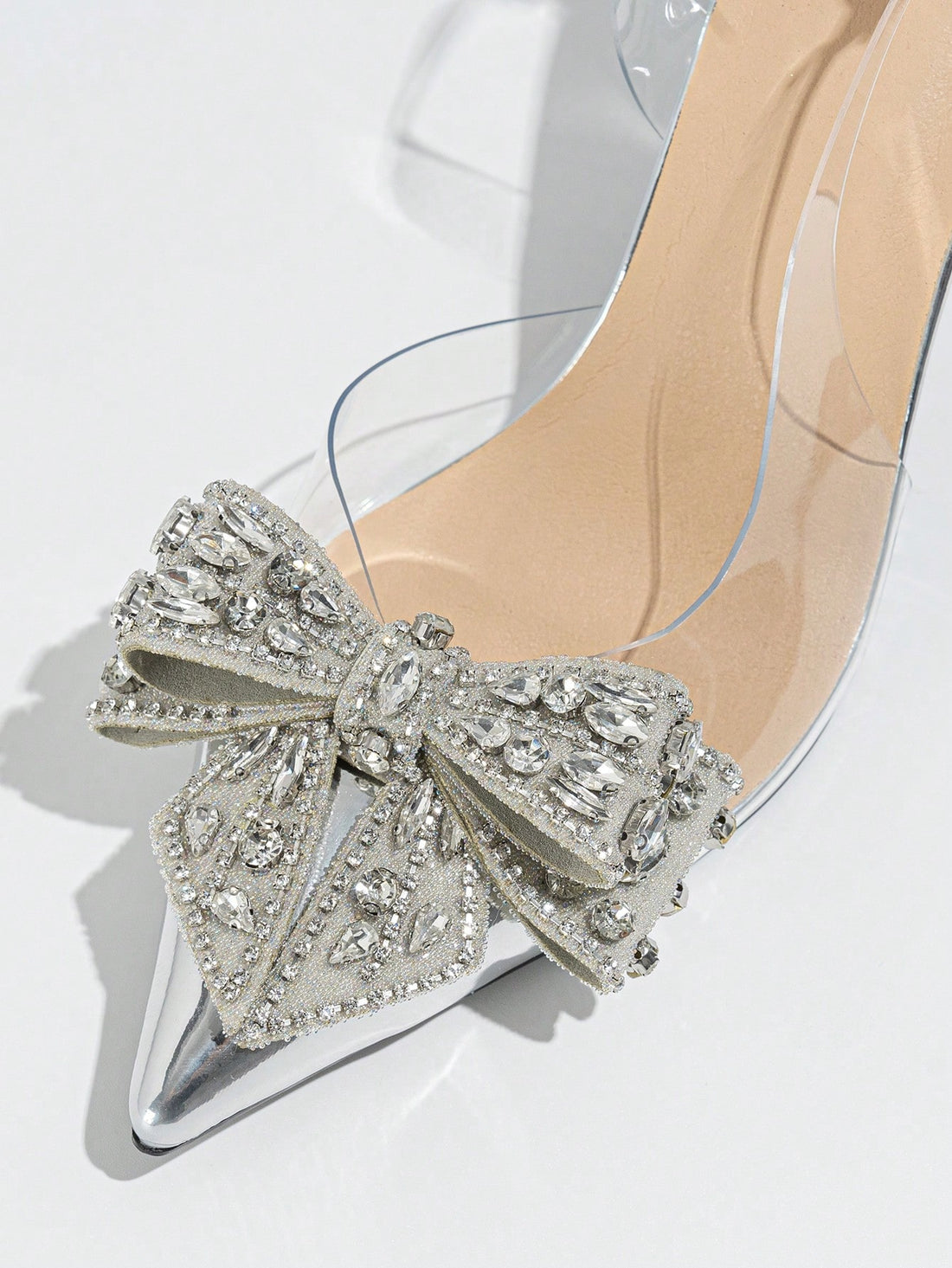 The perfect addition to any party or dance ensemble, these Elegant Rhinestone Bowknot Stiletto Heels exude sophistication and style. The rhinestone detailing and delicate bowknot add a touch of elegance, while the stiletto heel provides height and a sleek silhouette. Ideal for any special occasion, these heels are sure to elevate your look.