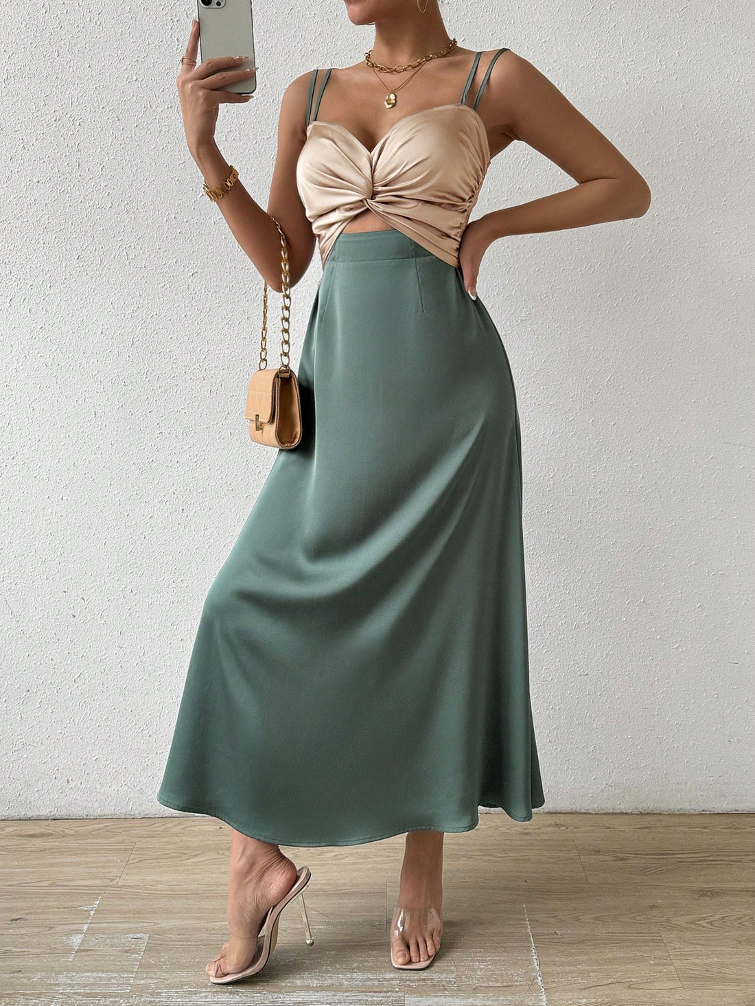 Upgrade your summer wardrobe with our Twisted Knot Color Block Cami Dress. Show off your playful and sophisticated side with our bold color blocking design, while staying cool and comfortable with the cami style. Perfect for any summer occasion.