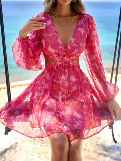 Elevate your spring and summer wardrobe with our Floral Fantasy: Long Sleeve V-Neck Dress. Made with a stunning floral print, this dress features a stylish v-neck and long sleeves, perfect for any vacation. Get ready to turn heads and make a statement in this must-have piece.