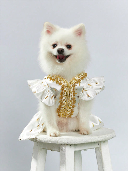 Make your furry companion the center of attention with our Dazzling Gold Foil Printed Satin Pet Dress. Perfect for stylish cats and dogs, this glamorous clothing will make them stand out in any event. The gold foil print adds a touch of class and luxury, making your pet the envy of all.