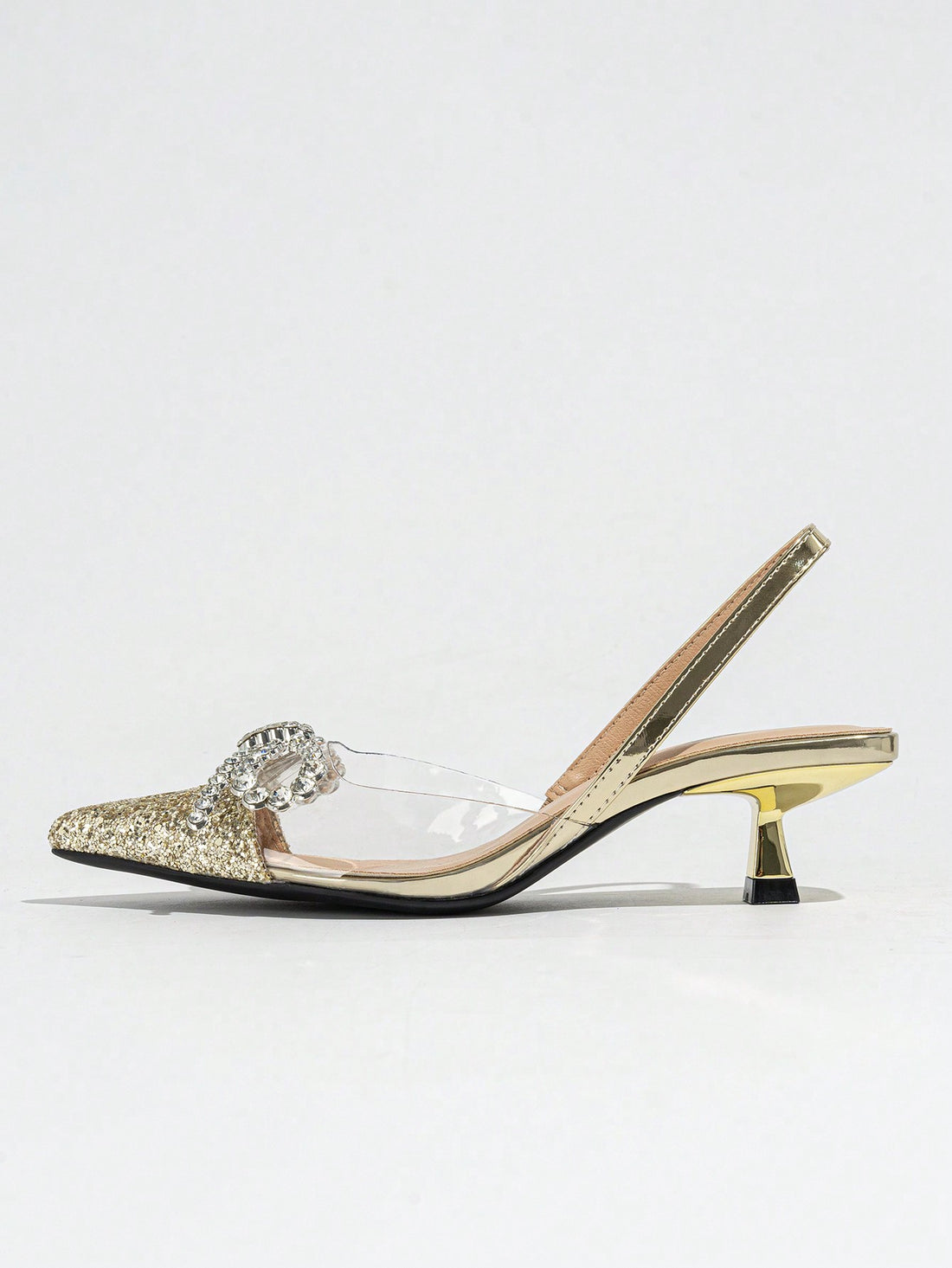 Step into sparkle with these Elegant Silver Pointed Toe Slingback Pumps! Featuring a dazzling rhinestone bow, they add just the right touch of glam to your wedding or formal event outfit. The sleek pointed toe and slingback design keep things chic and comfortable, so you can dance the night away with confidence and style. Perfect for making every step shine!