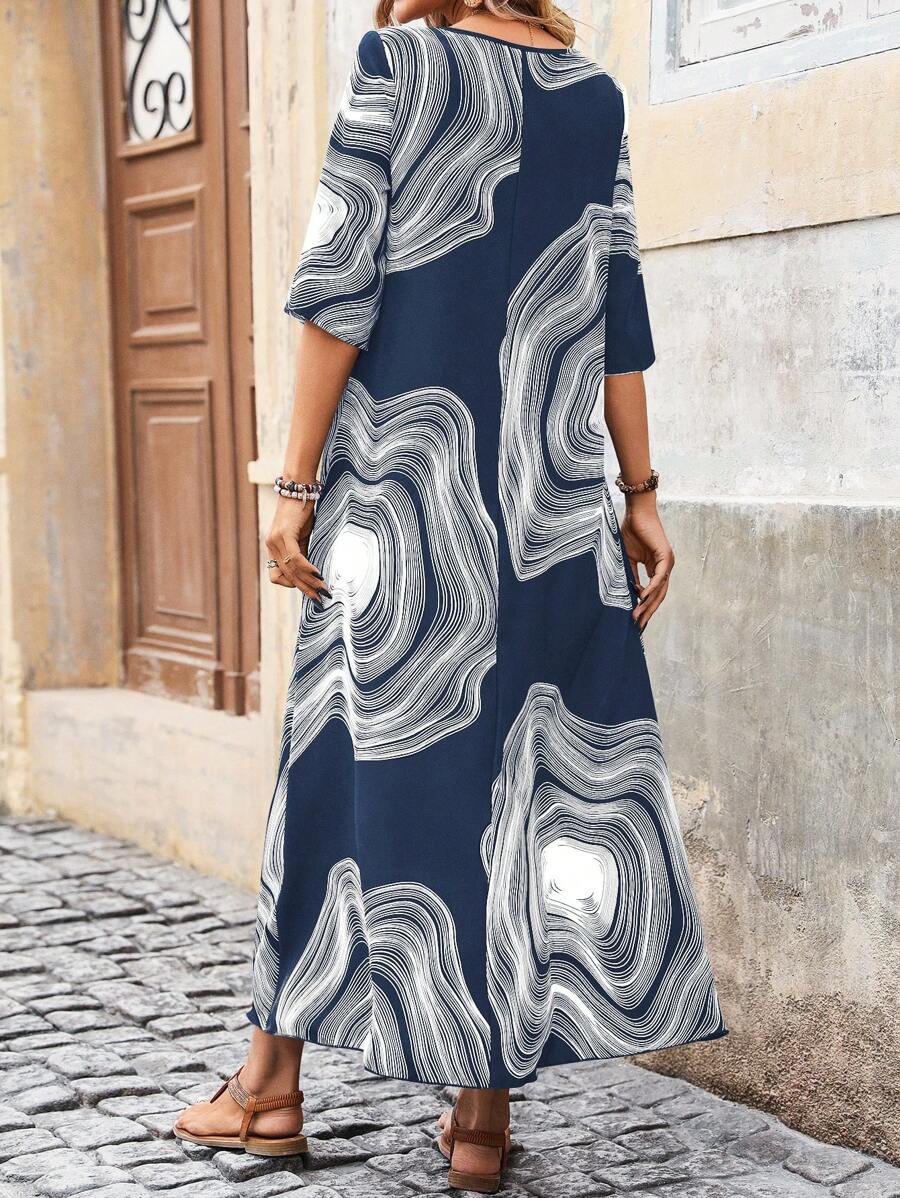 Back view of navy blue printed maxi dress with relaxed straight silhouette