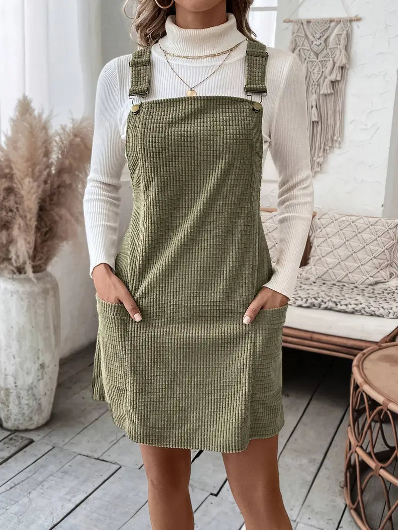 This Cozy Chic overall dress features a stylish plaid print and convenient pocket patches. Made with comfortable and soft materials, it is perfect for achieving a casual yet trendy look. Stay cozy and chic with this versatile and fashionable dress.