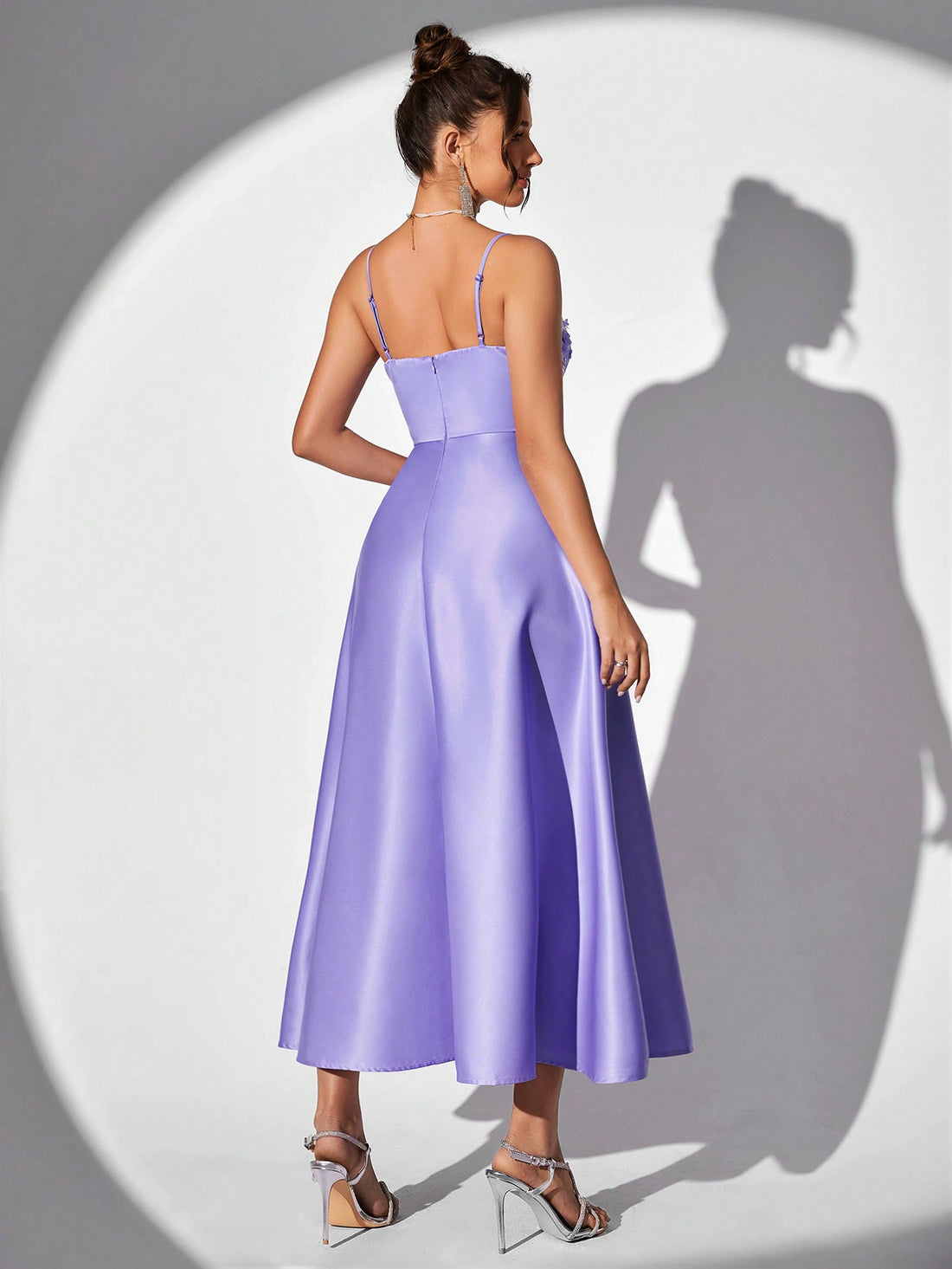 This enchanting lavender spaghetti strap evening gown exudes grace and elegance. The glittering floral accents add a touch of glamour to this timeless piece. Made with the highest quality materials, this gown is perfect for any special occasion. Style and sophistication combined in one stunning dress.