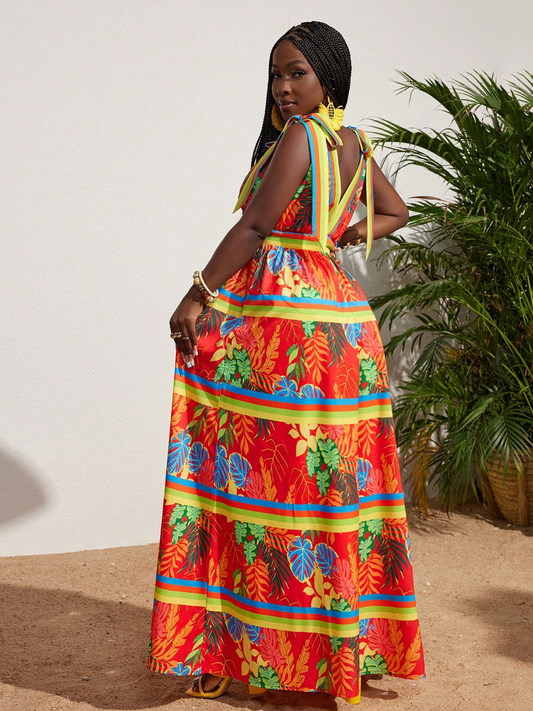 Enhance your wardrobe with our Tropical Bliss V-Neck Dress! Perfect for bringing island vibes to your style, this dress features a flattering v-neck design and vibrant tropical print. Embrace the warm weather and turn heads with this must-have addition to your closet.