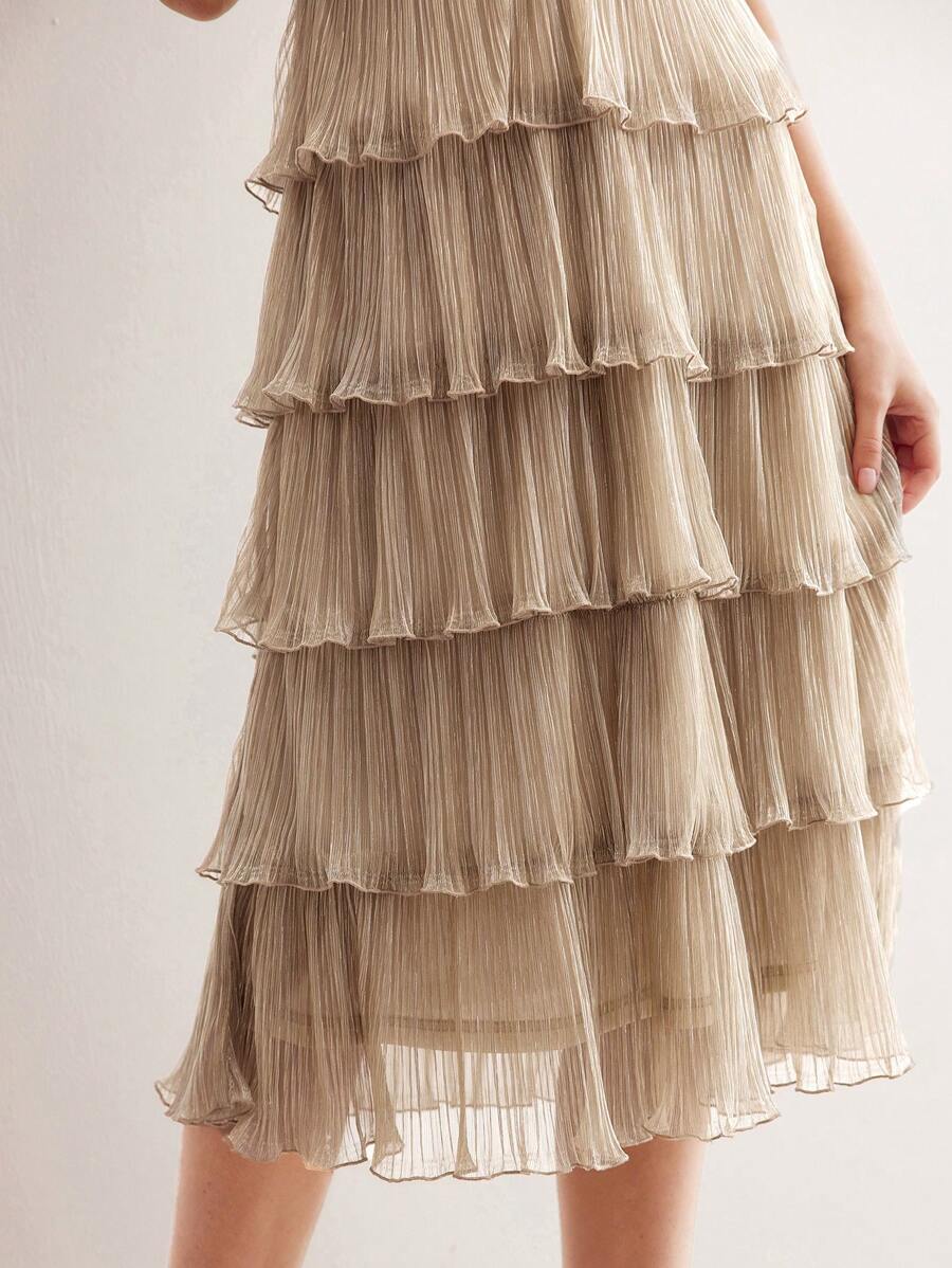 Slip into sophistication with this stunning metallic plisse tiered dress—where luxury meets laid-back glamour. The shimmering fabric catches light beautifully, while cascading tiers create movement and dimension that flatters every frame. Perfect for elevating your everyday look or turning heads at special occasions, this premium piece proves that effortless style doesn't mean compromising on elegance. Versatile, eye-catching, and undeniably chic.