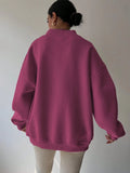 Back view of red violet oversized sweatshirt with dropped shoulders and rib-knit trim