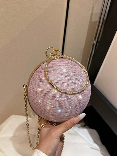 This miniature handbag is designed to make a statement with its shimmering sphere shape and glittery texture. Perfect for adding a touch of glam to any outfit, it's a must-have accessory for any fashionista. Crafted with precision and attention to detail, this handbag is sure to turn heads and catch the eye of any fashion lover.