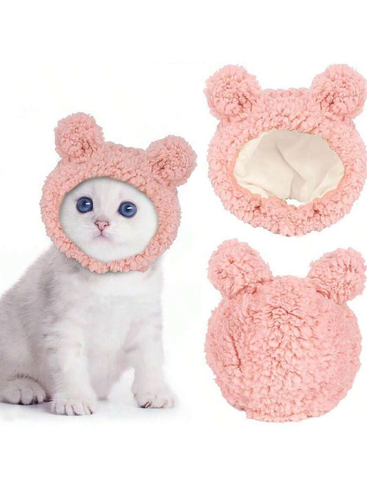 Keep your furry friend warm and stylish with Cozy Critter Couture's Bear Shaped Plush Pet Hat. Made for both dogs and cats, this hat features a cute bear design and is sure to keep your pet cozy during the colder months. A must-have accessory for any fashion-forward pet owner.