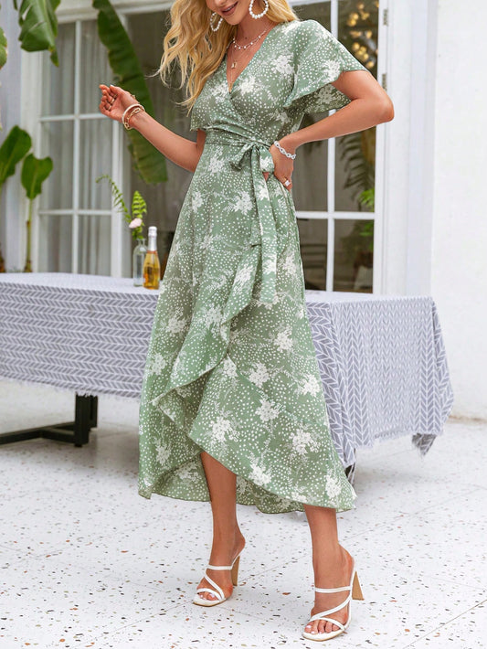 Experience effortless elegance in our Floral Elegance dress. With a simple slit design and beautiful ruffle wrap detail, this dress is both feminine and sophisticated. The bell sleeves add a touch of whimsy, making it perfect for any occasion. Embrace your style with Floral Elegance.