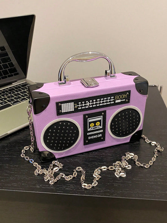 Introducing the Radiant Melody: Purple Radio Handbag, a trendy music-inspired crossbody bag. With its stylish design and convenient crossbody strap, this bag is perfect for carrying all your essentials while adding a touch of music to your outfit. Made from high-quality materials, it is both durable and fashionable. Elevate your fashion game with this must-have accessory.