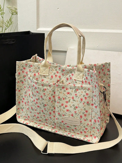This Simply Sweet Floral Polka Dot Tote is the perfect accessory for work, school, or weekend getaways. With its vibrant floral and polka dot design, it adds a touch of style to any outfit. Made with durable materials, this tote can withstand the daily grind and provide ample storage space for all your essentials. Stay organized and fashionable with this versatile tote.