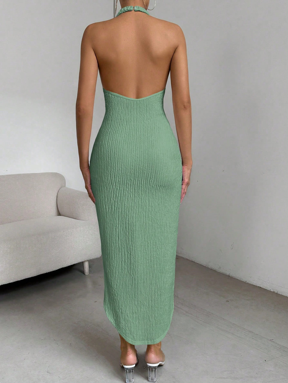 Introducing the Chic Asymmetrical Halter Neck Backless Dress in Solid Color! With its unique design and flattering cut, this dress is perfect for any occasion. Made with high-quality materials, it offers both style and comfort. Show off your fashion sense with this must-have dress.