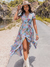 This high-waisted slit dress features a vibrant floral print, perfect for the spring season. With its bold colors and flattering silhouette, this dress is sure to make a statement. Elevate your style with this must-have addition to your wardrobe.