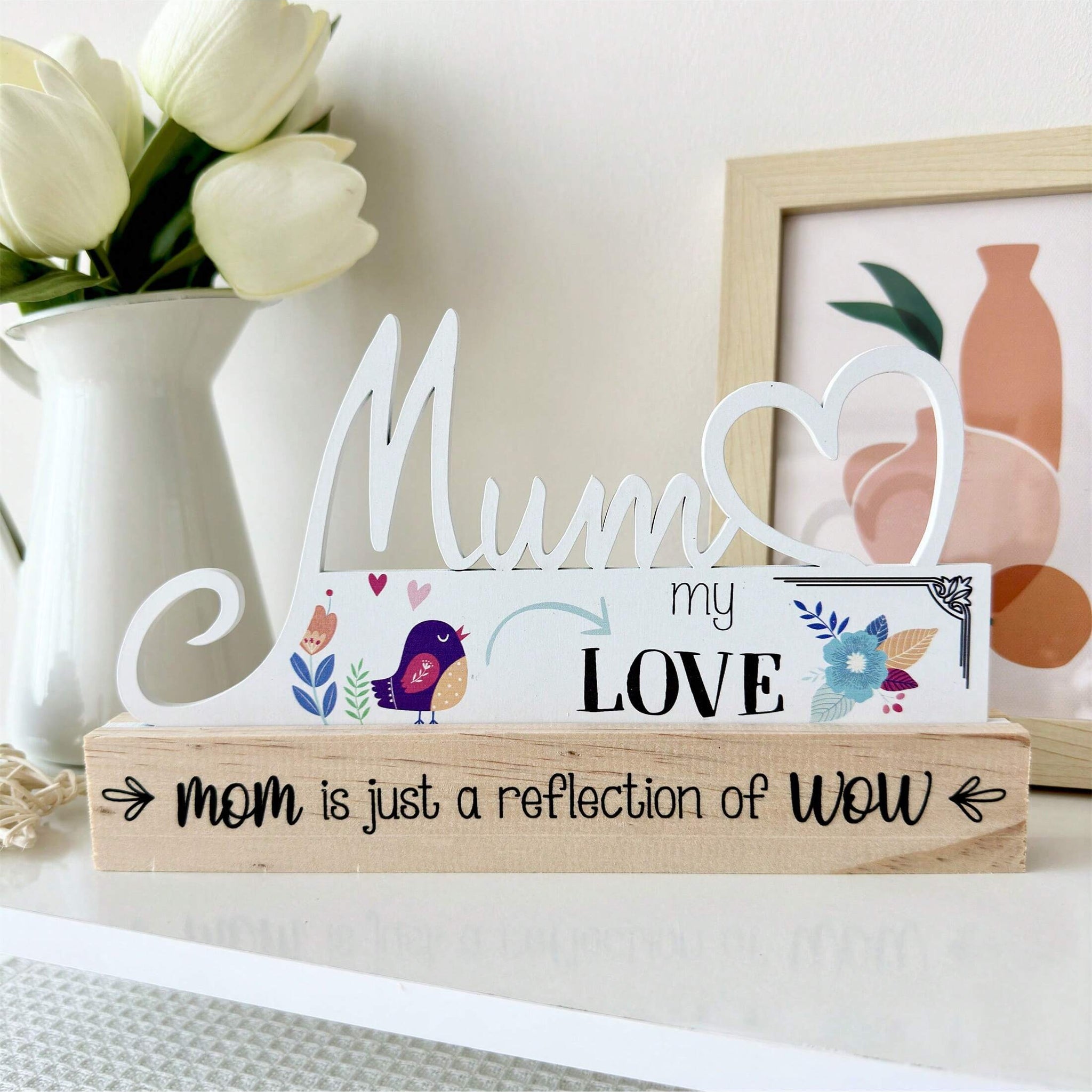 Celebrate Mother's Day in style with this beautifully handcrafted wooden centerpiece. Perfect as a table decoration or <a href="https://canaryhouze.com/collections/ornaments" target="_blank" rel="noopener">gift</a> for Mom, this piece is made with care and attention to detail. Show your appreciation for all she does with this unique and thoughtful item.