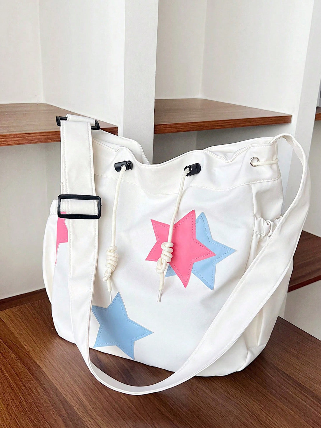 The Stylish Starry Summer Tote is a large capacity shoulder bag designed for students. With a trendy starry pattern and ample storage space, this tote combines fashion and function. Perfect for carrying books, laptops, and essentials, it's the perfect accessory for students on the go.