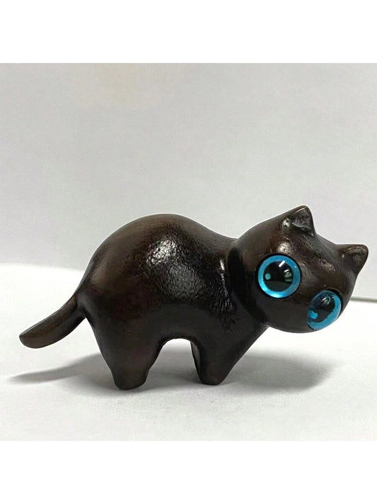 This hand-carved ebony wood mischievous cat animal model serves as a unique pet memorial toy and <a href="https://canaryhouze.com/collections/ornaments?sort_by=created-descending" target="_blank" rel="noopener">surprise gift</a> for festivals. Made from high-quality wood, it showcases expert craftsmanship and intricate details. Perfect for cat lovers, it adds a touch of elegance to any decor.