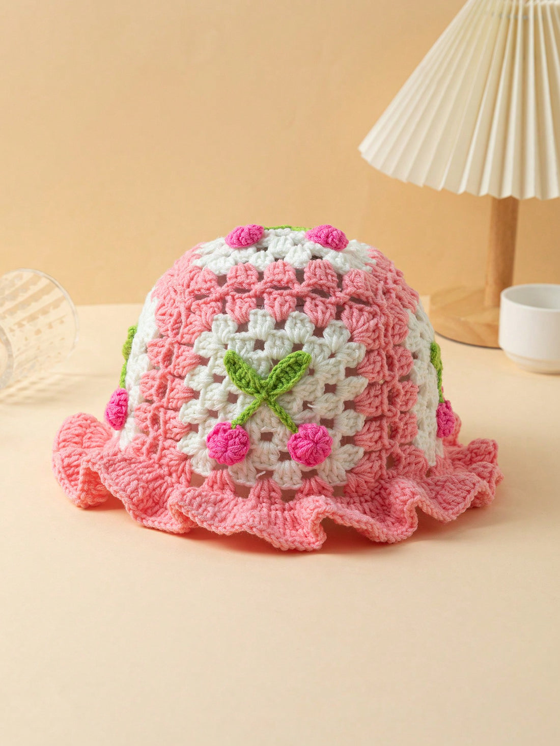 Stay cozy and stylish in our Pretty in Pink Fisherman Hat, handmade with a unique cherry pattern knit. This hat is perfect for any outdoor adventure, keeping you warm and fashionable with its soft and durable material. Elevate your winter look with this one-of-a-kind hat.