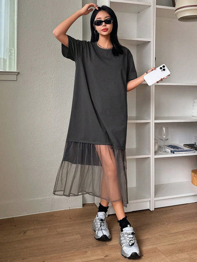 Elevate your wardrobe with the Mesh Spliced T-Shirt Dress: Effortless Style for Women. Made with breathable mesh fabric and a flattering t-shirt silhouette, this dress offers both style and comfort. Perfect for any occasion, it's a must-have for every fashion-forward woman.