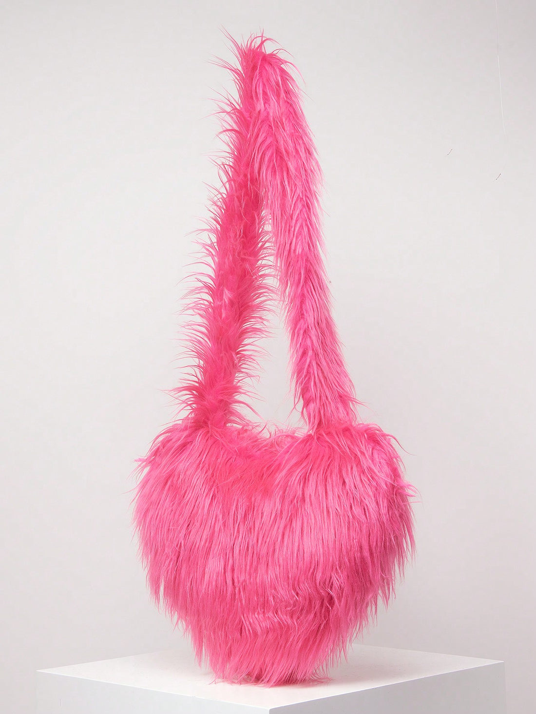 Add a touch of style to your wardrobe with our Stylish Candy-Colored Furry Crossbody Bag. This bag is not only perfect for the fall and winter season, but it also makes for the perfect gift for any lady. Its unique design and soft fur material are sure to make a statement while keeping your belongings safe and organized.