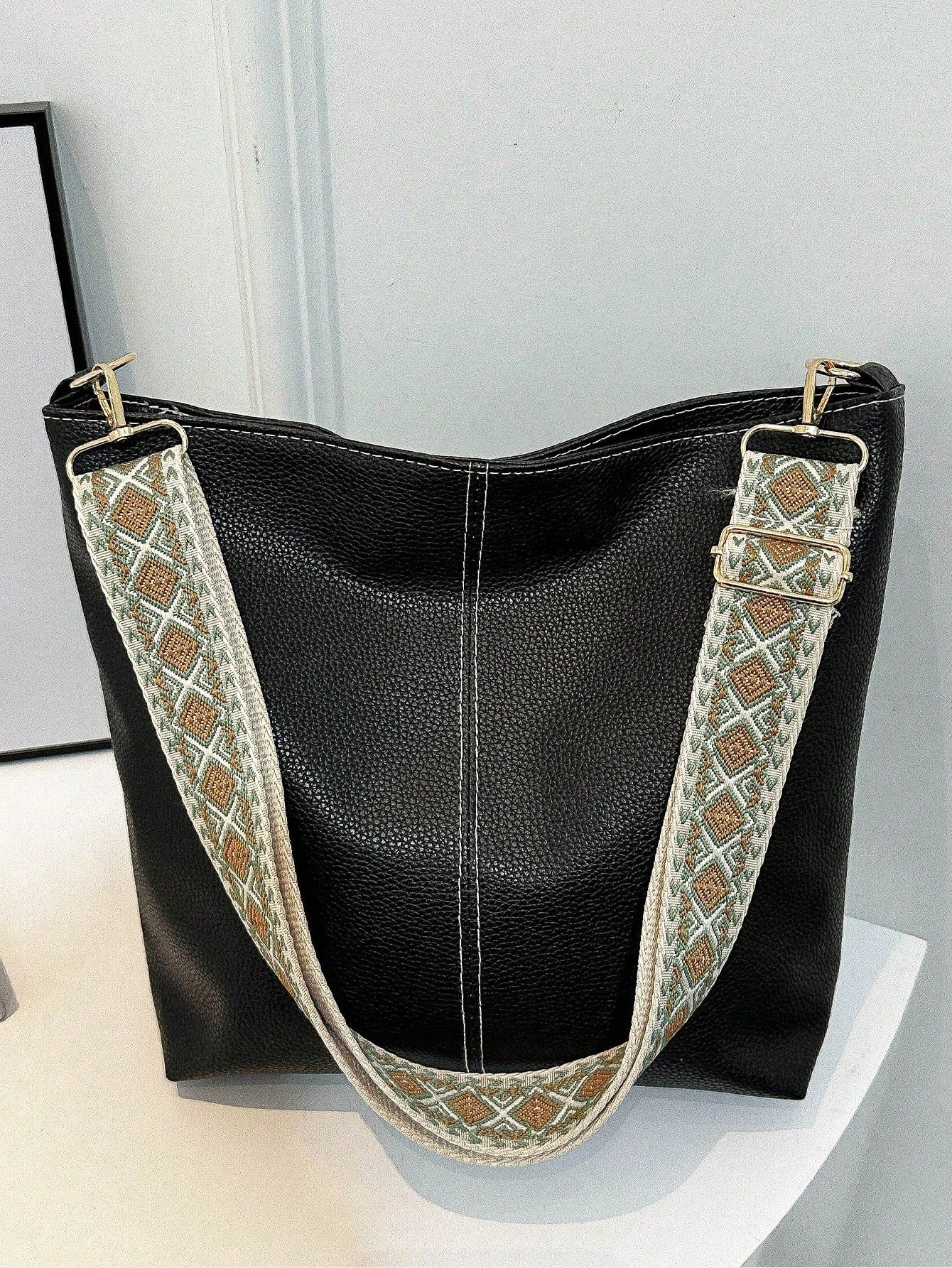 Expertly crafted for modern women, our Classic Chic Tote <a href="https://canaryhouze.com/collections/canvas-tote-bags?sort_by=created-descending" target="_blank" rel="noopener">Bag</a> boasts a spacious interior to hold all your essentials. Perfect for work, a night out, or a weekend getaway, this stylish shoulder bag is versatile and functional. With its solid color design, it's a timeless accessory for any occasion.