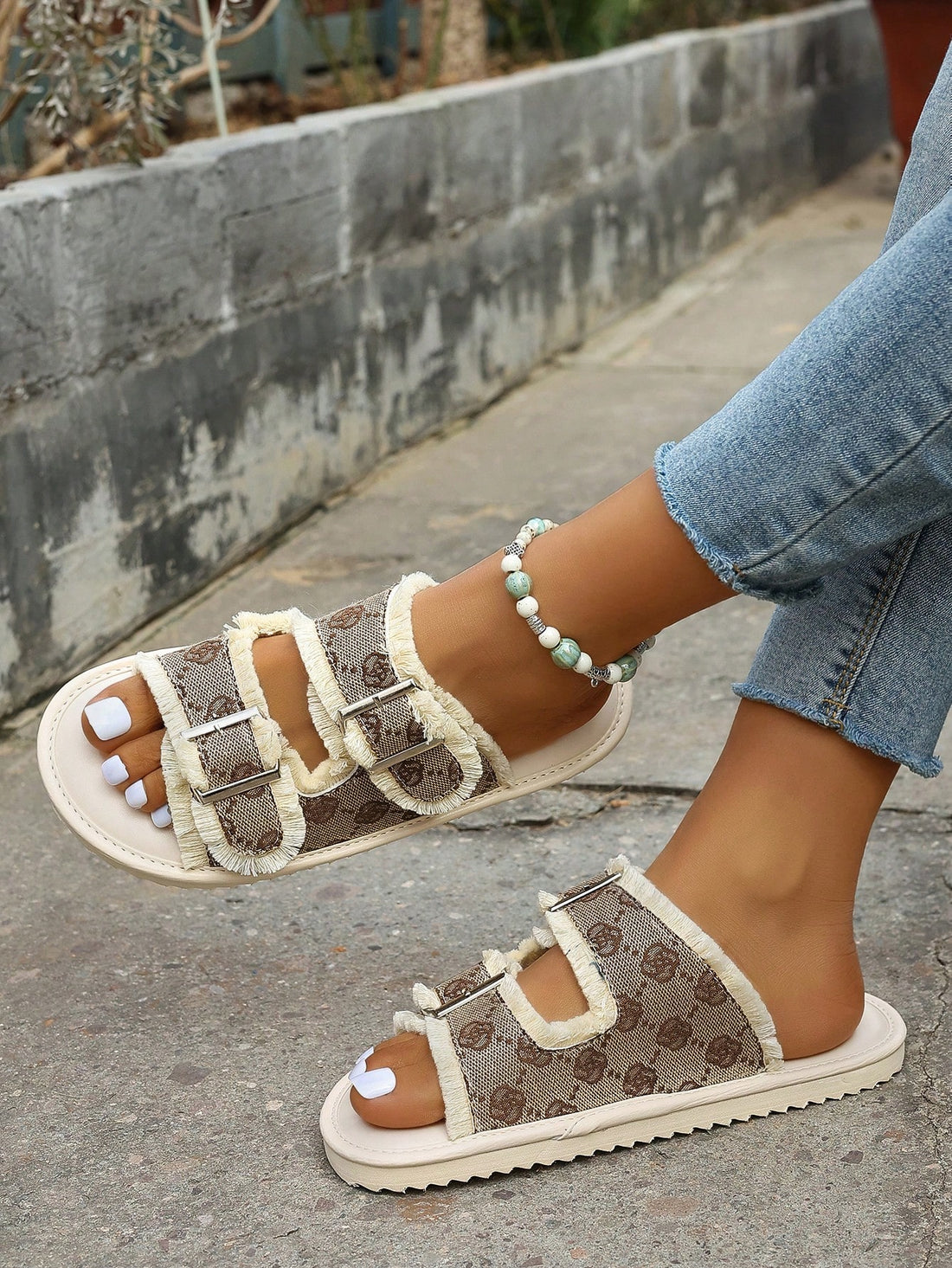 These Floral Bliss beige flat sandals feature a delicate flower design and a soft sole for ultimate comfort. Perfect for a day out or a casual evening, these sandals are sure to add a touch of elegance to any outfit. Handcrafted with high quality materials, these sandals offer both style and durability.