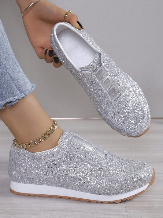 Experience ultimate comfort and style with our Glittering Comfort Slip-On Flat <a href="https://canaryhouze.com/collections/women-canvas-shoes" target="_blank" rel="noopener">Sneakers</a>. Featuring an elastic topline for a secure fit, these sneakers are perfect for all-day wear. The glitter detailing adds a touch of sparkle to any outfit. Get ready to dazzle with these must-have sneakers.