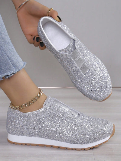 Experience ultimate comfort and style with our Glittering Comfort Slip-On Flat <a href="https://canaryhouze.com/collections/women-canvas-shoes" target="_blank" rel="noopener">Sneakers</a>. Featuring an elastic topline for a secure fit, these sneakers are perfect for all-day wear. The glitter detailing adds a touch of sparkle to any outfit. Get ready to dazzle with these must-have sneakers.