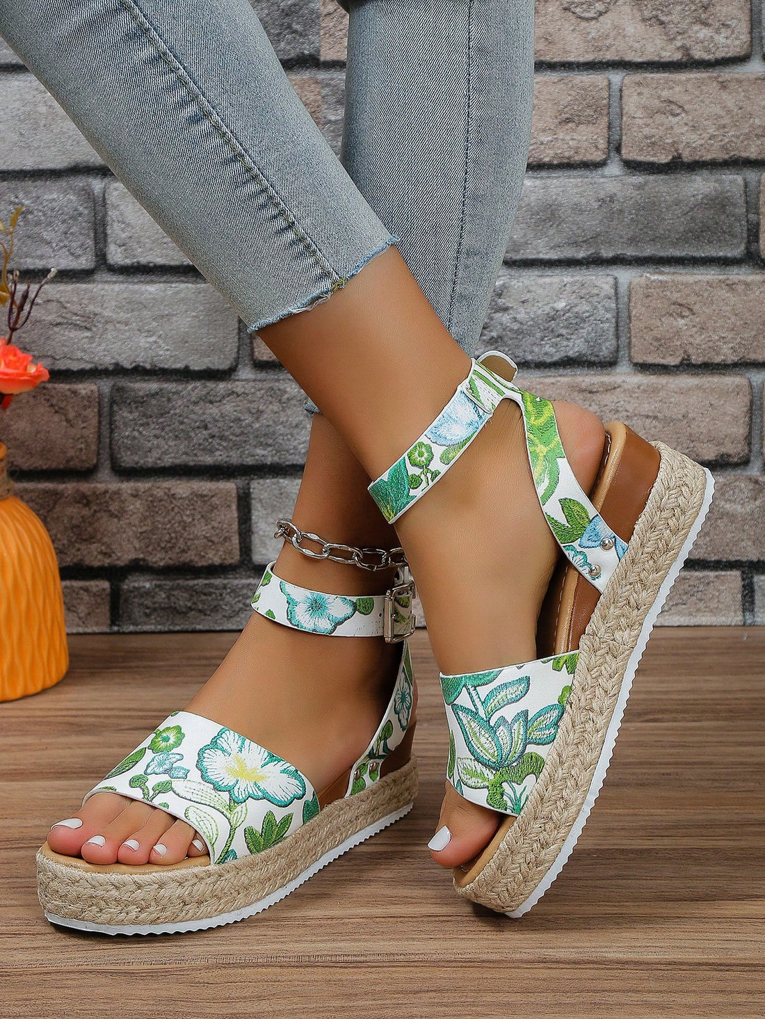 Elevate your summer style with our Womens Plus Size Floral Woven Wedge Sandals. The intricate floral design adds a touch of elegance, while the wedge heel provides all-day comfort. Perfect for any occasion, these sandals will have you looking and feeling chic all season long.