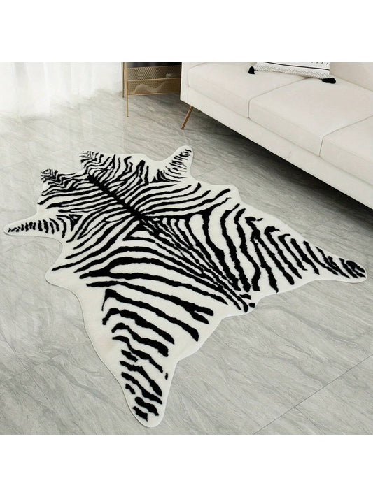 Enhance your home decor with our Zebra Pattern Plush <a href="https://canaryhouze.com/collections/rugs-and-mats?sort_by=created-descending" target="_blank" rel="noopener">Rug</a>. Its soft and cozy texture adds comfort and warmth to any living room, bedroom, kitchen, or other space. The stylish zebra pattern adds a touch of exoticism to your interior design. Available in various sizes for a perfect fit.