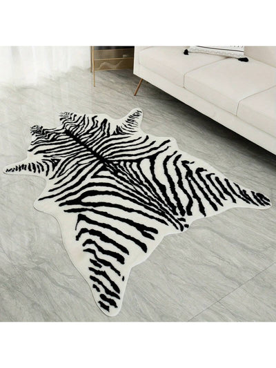 Enhance your home decor with our Zebra Pattern Plush <a href="https://canaryhouze.com/collections/rugs-and-mats?sort_by=created-descending" target="_blank" rel="noopener">Rug</a>. Its soft and cozy texture adds comfort and warmth to any living room, bedroom, kitchen, or other space. The stylish zebra pattern adds a touch of exoticism to your interior design. Available in various sizes for a perfect fit.