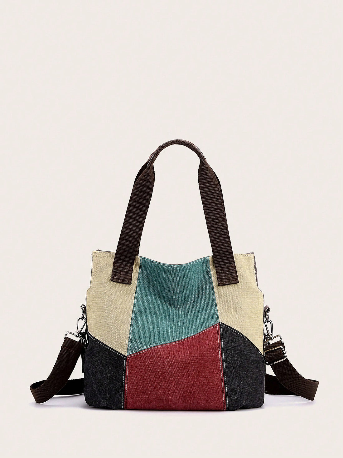This chic tote <a href="https://canaryhouze.com/collections/canvas-tote-bags?sort_by=created-descending" target="_blank" rel="noopener">bag</a> combines canvas and splicing techniques for a stylish and versatile hobo style. With its spacious interior and durable materials, it's perfect for daily use or to elevate your outfit. The perfect choice for women looking for a functional and fashionable bag